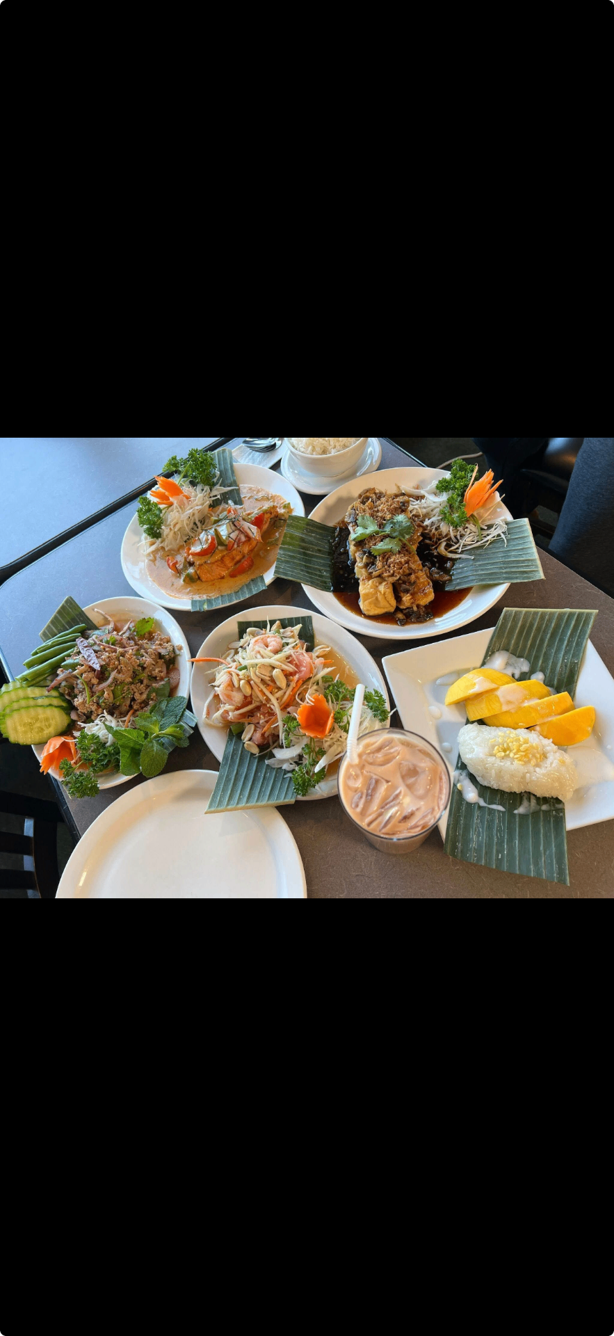 Thai food spread with Pad Thai, curries, and spring rolls
